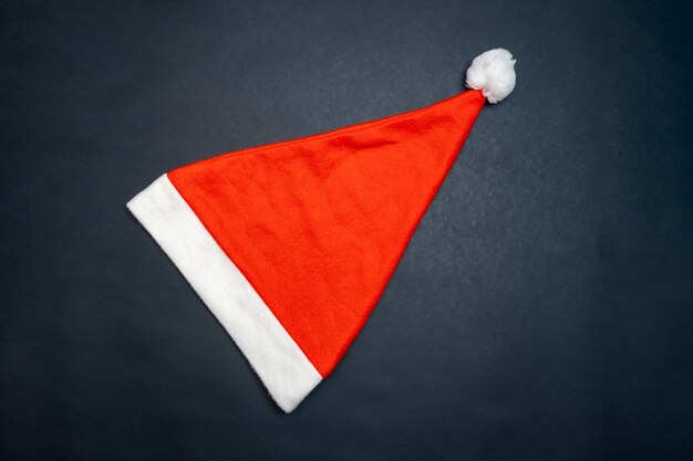 Christmas hat on black background copy space for text