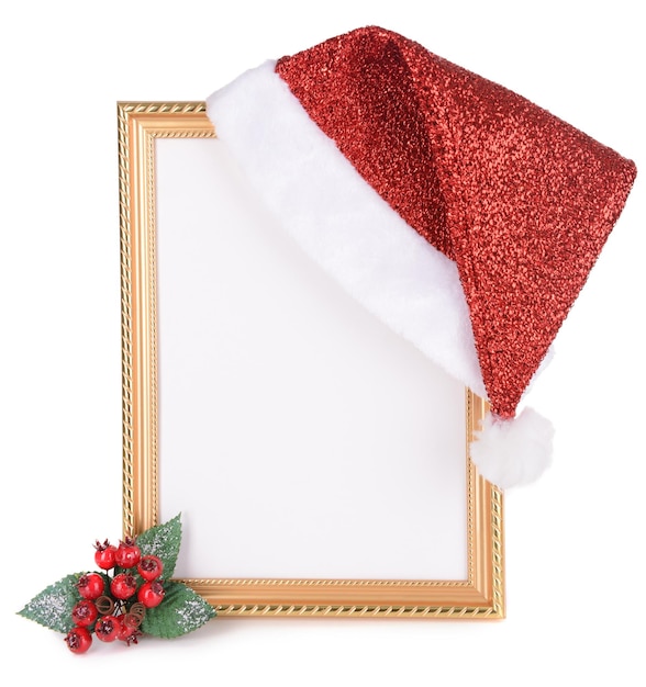 Christmas hat hung on old frame isolated on white