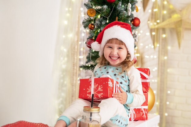 Christmas holiday atmosphere brings happiness to the house. boxes of gifts tied with satin ribbons