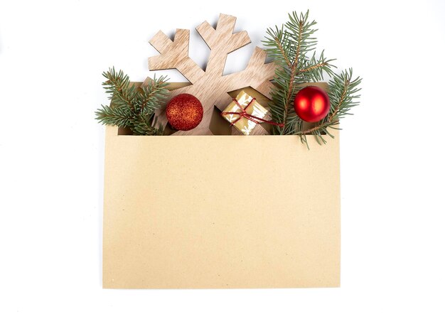 Christmas Holiday Background, open envelope with red balls,spruce branches,copy space