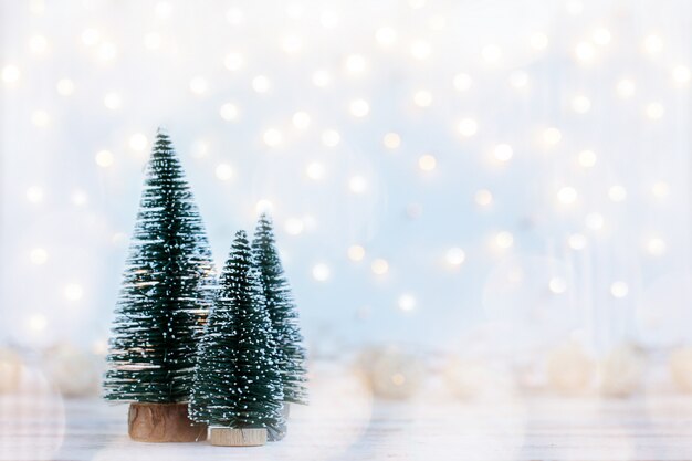 Christmas holiday background with three fir tree.