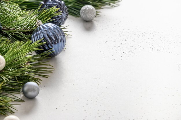 Christmas holiday composition with blue baubles and evergreen branches