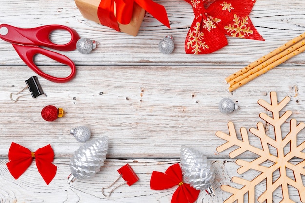 Christmas holiday decorations flatlay on light wooden background