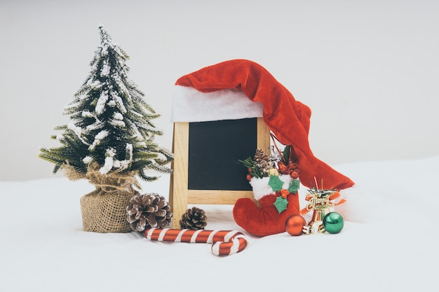 Christmas holiday decorations with blackboard on white background.