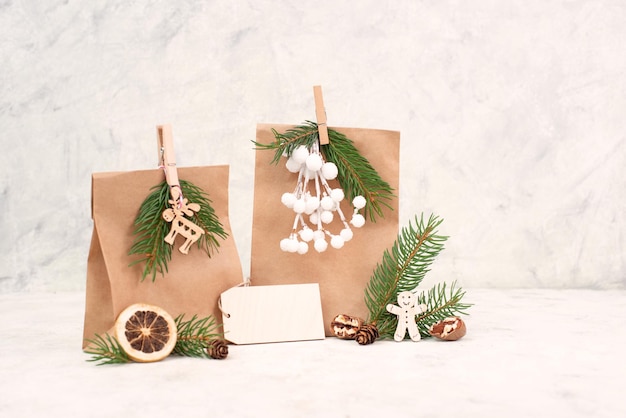 Christmas holiday gift bags for suprise fir branches gingerbread man elk snow covered berries