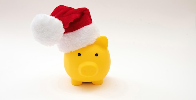 Christmas holiday Sale Piggy bank with Santa hat isolated on white