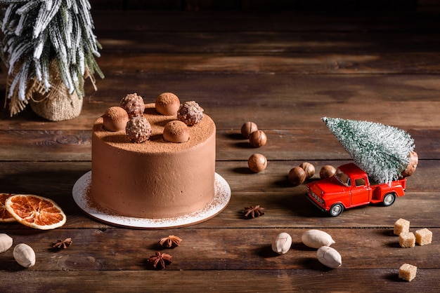 Christmas holiday table with delicious truffle cake and beautiful gingerbreads