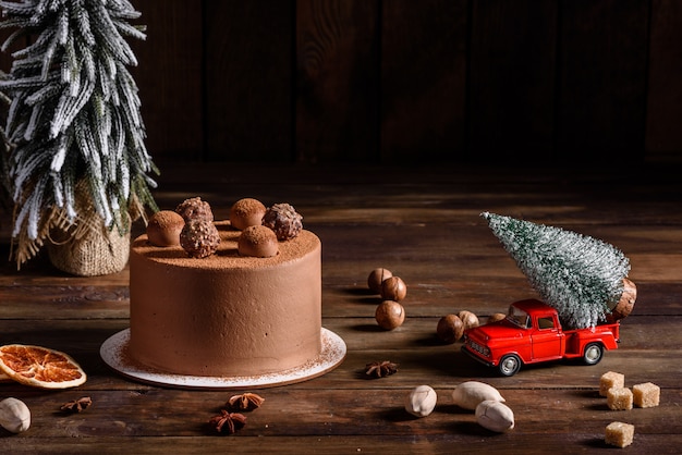 Christmas holiday table with delicious truffle cake and beautiful gingerbreads