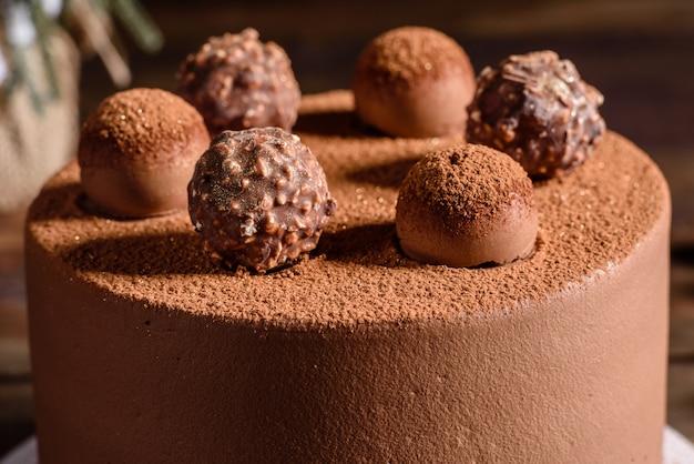 Christmas holiday table with delicious truffle cake and beautiful gingerbreads