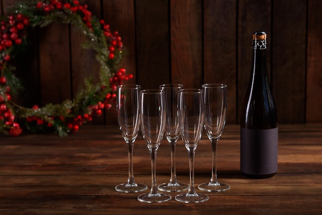 Christmas holiday table with glasses and a bottle 