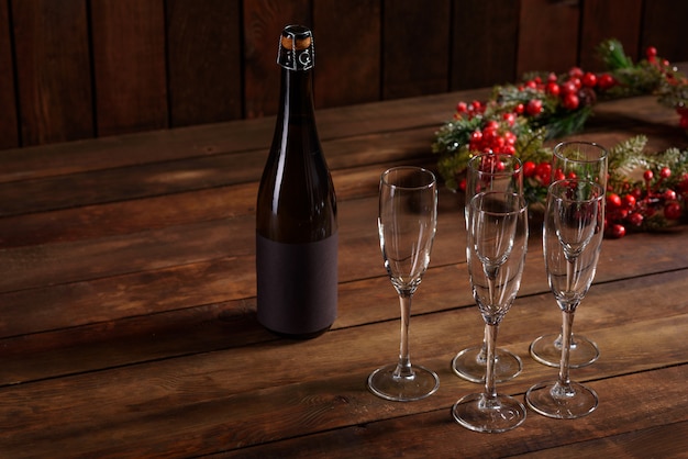 Christmas holiday table with glasses and a bottle 