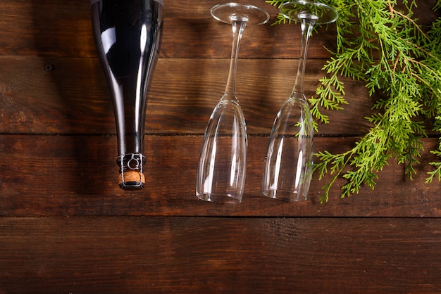 Christmas holiday table with glasses and a bottle 