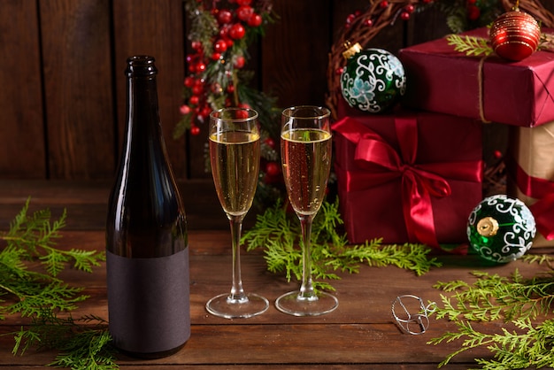 Christmas holiday table with glasses and a bottle 