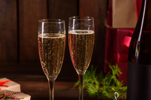 Christmas holiday table with glasses and a bottle