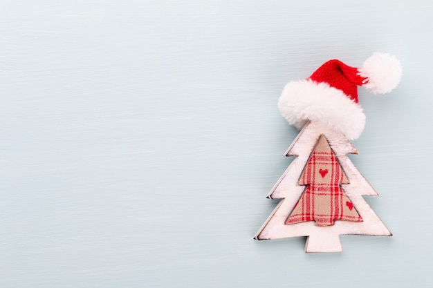 Christmas holidays composition on wooden background.
Christmas tree decoration and copy space for your text.
