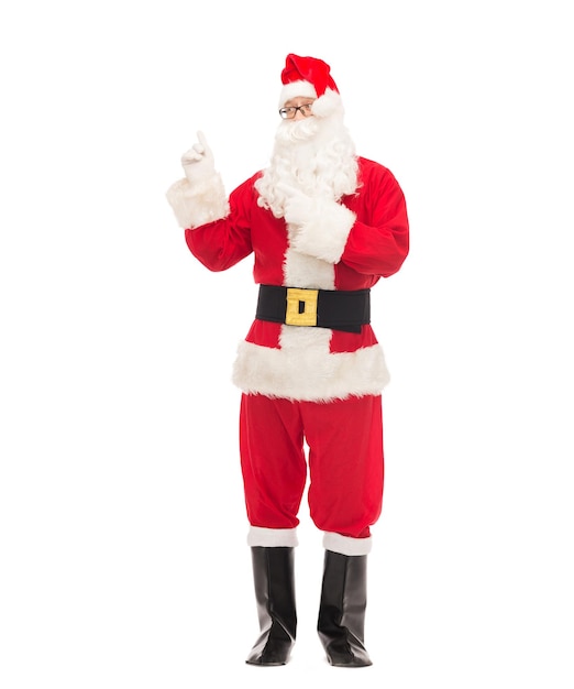 christmas, holidays, gesture and people concept - man in costume of santa claus pointing fingers