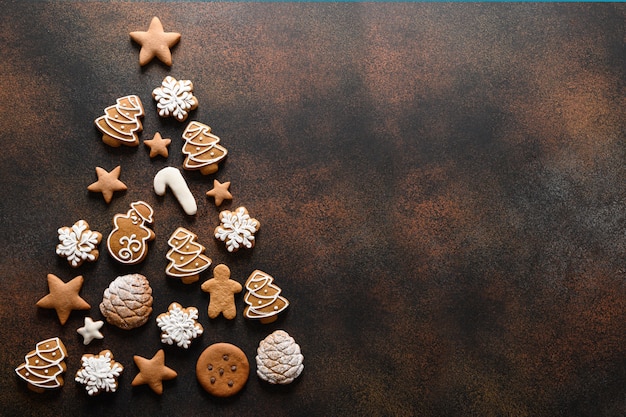 Christmas holidays homemade cookies arranged as tree on brown