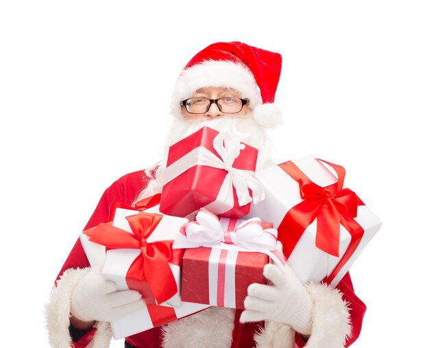 christmas, holidays and people concept - man in costume of santa claus with gift boxes