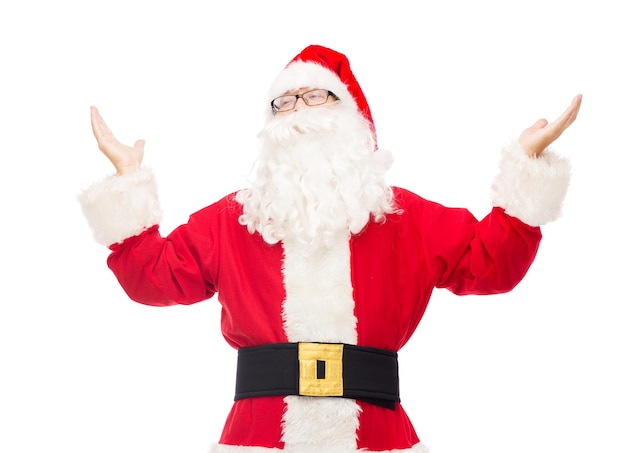 christmas, holidays and people concept - man in costume of santa claus with raised hands