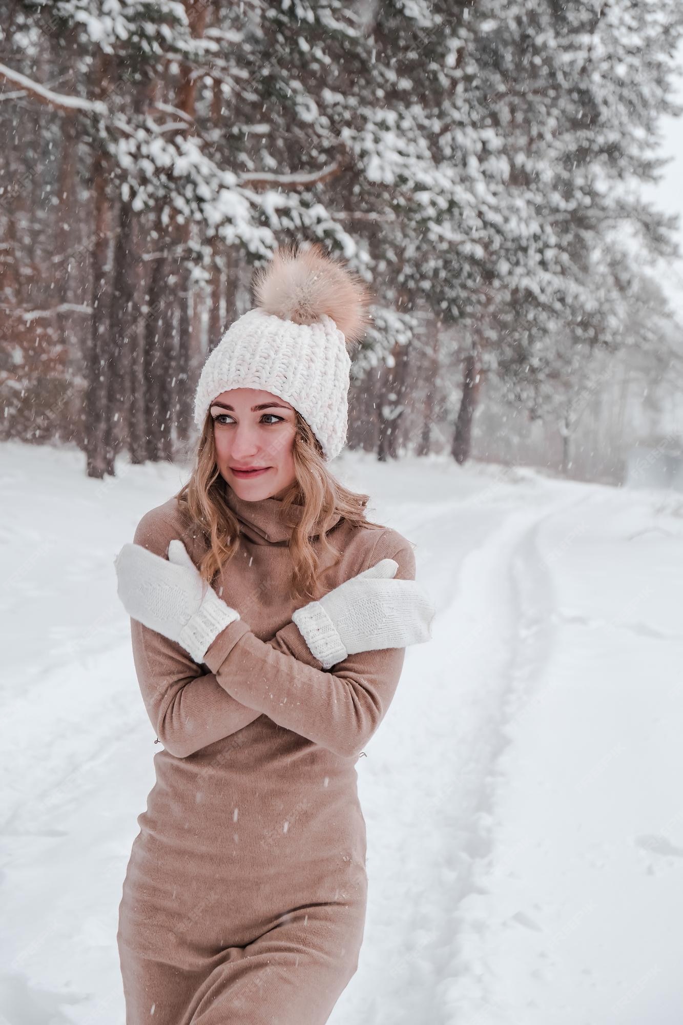 Premium Photo  Happy woman on the winter forest background. young