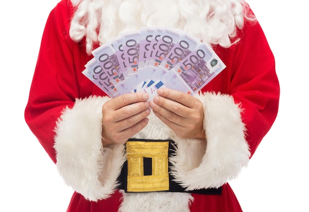クリスマス、休日、勝利、通貨と人々の概念-ユーロのお金でサンタクロースのクローズアップ