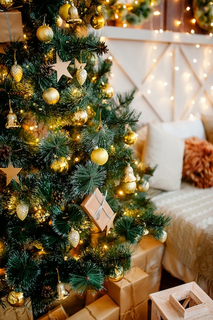 Christmas home decoration with Christmas tree and gift boxes