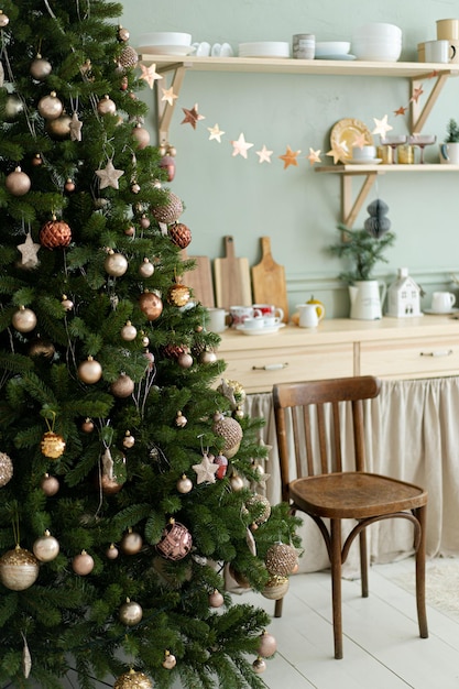 Christmas home decorations. red and green christmas colors. Kitchen at Christmas. Big Christmas tree