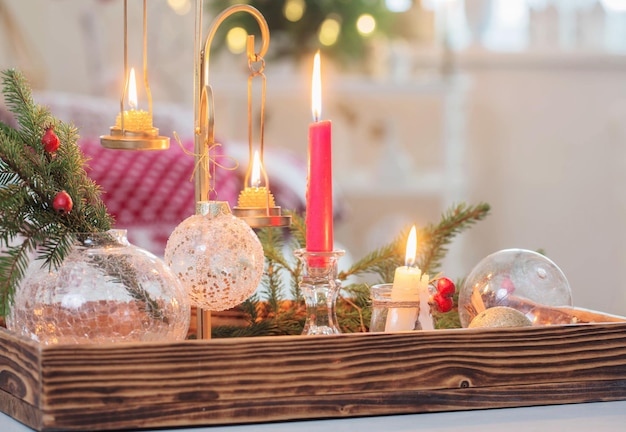 Christmas home decorations with candles in red and white colors