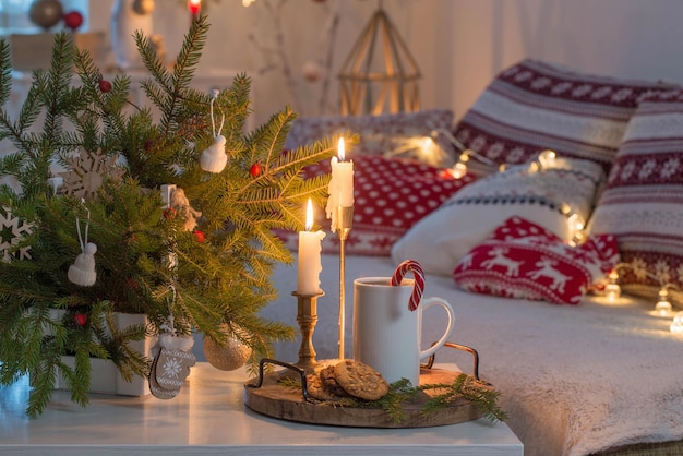 Christmas home decorations with candles in red and white colors