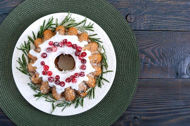 Christmas homemade fruitcake decorated with rosemary