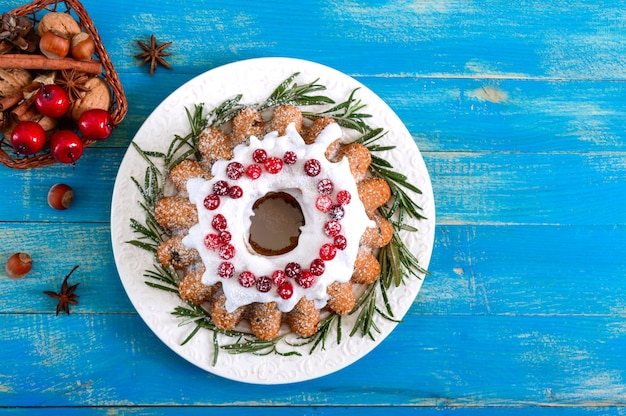 Christmas homemade fruitcake decorated with rosemary