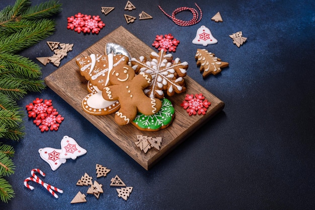 Christmas homemade gingerbread cookies on a dark concrete table\
table