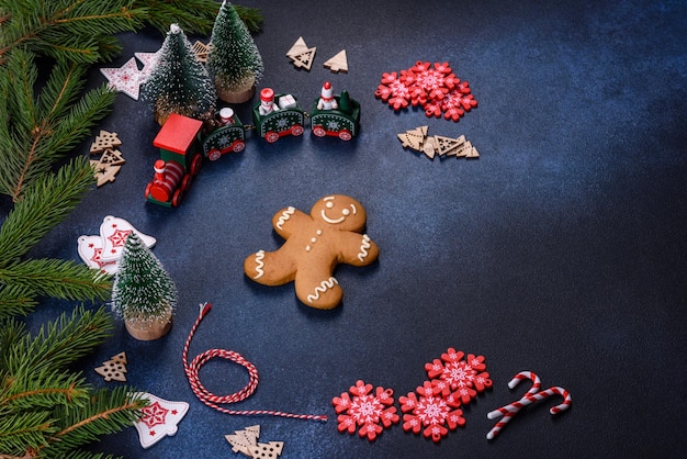 Christmas homemade gingerbread cookies on a dark concrete table table