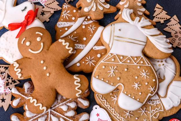 Christmas homemade gingerbread cookies on dark concrete table