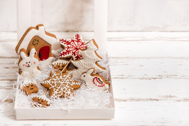 Christmas homemade gingerbread cookies on wooden table.