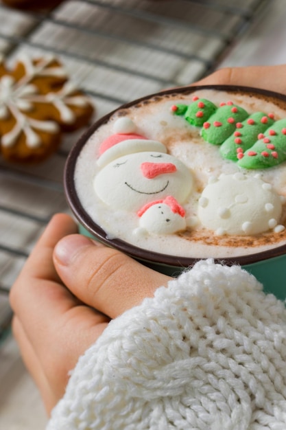 Christmas hot chocolate with snowman marshmallow in the cup