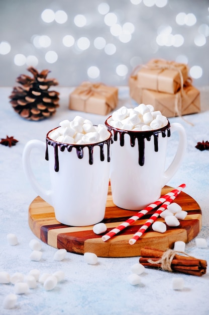 Christmas hot drink with marshmallows and gifts