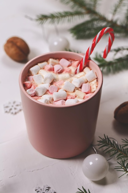 Christmas hot drinks winter cocoa with marshmallows and spruce branches on a white background