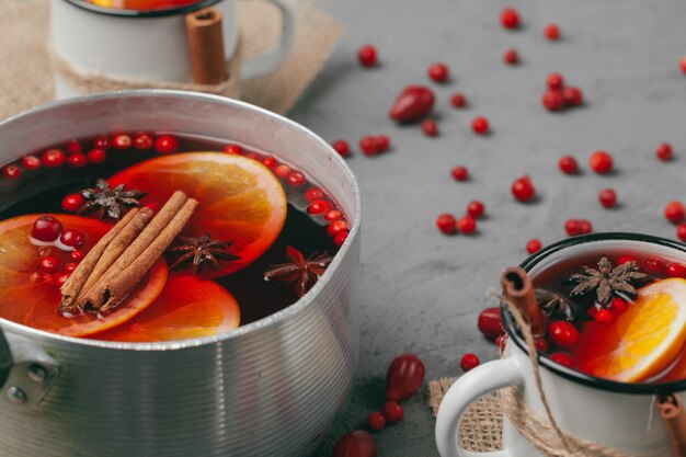 christmas hot mulled wine in rustic cup close up