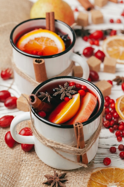 Christmas hot mulled wine in rustic cup close up