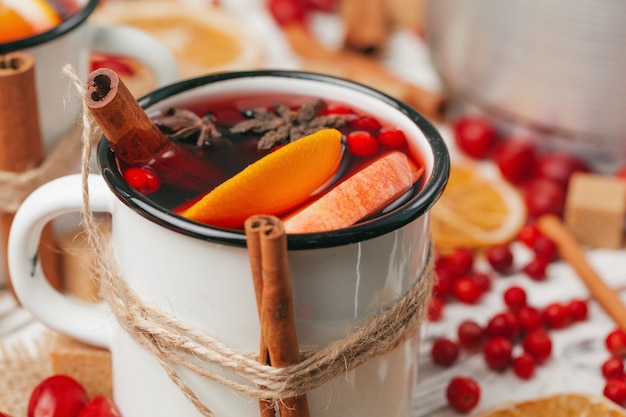 Christmas hot mulled wine in rustic cup close up