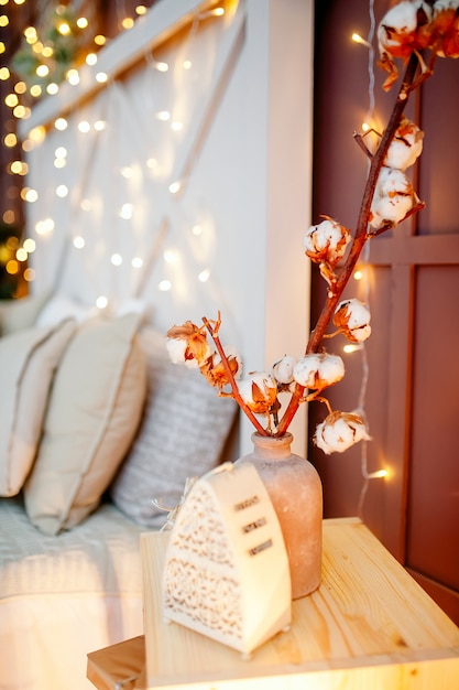 Christmas interior decoration of bedroom with christmas lights