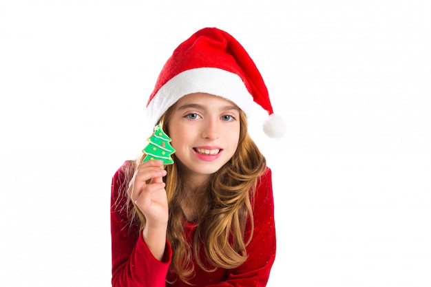 Christmas kid girl holding Xmas tree cookie