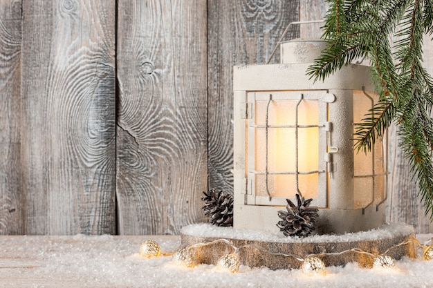 Christmas lantern and decoration on snow