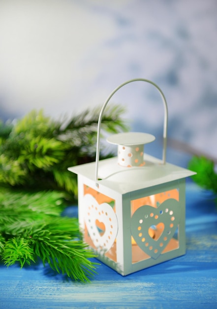 Christmas lantern, fir tree and decorations  on dark background