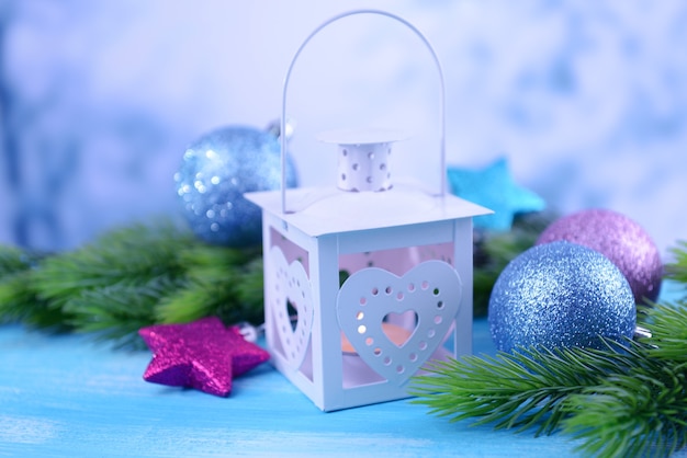 Christmas lantern, fir tree and decorations  on light background