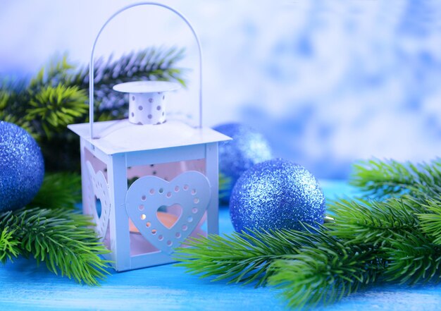 Christmas lantern, fir tree and decorations  on light background