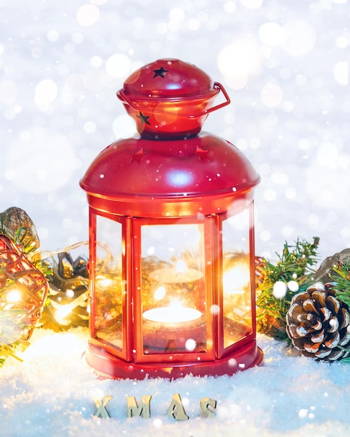 Christmas Lantern with decorations on snow