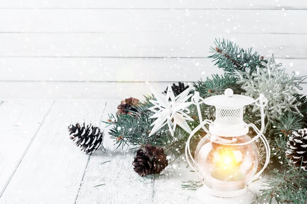 Christmas latern on a white wooden background