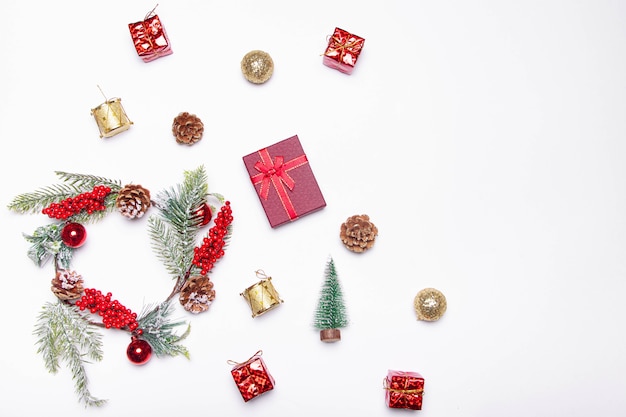 Christmas layout on a white background . Red gifts and fir-tree branches. Christmas and New year. Holiday.